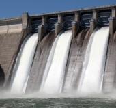 Water gushing out of a dam, using channels designed to relieve the pressure. Photo: Robert Linder